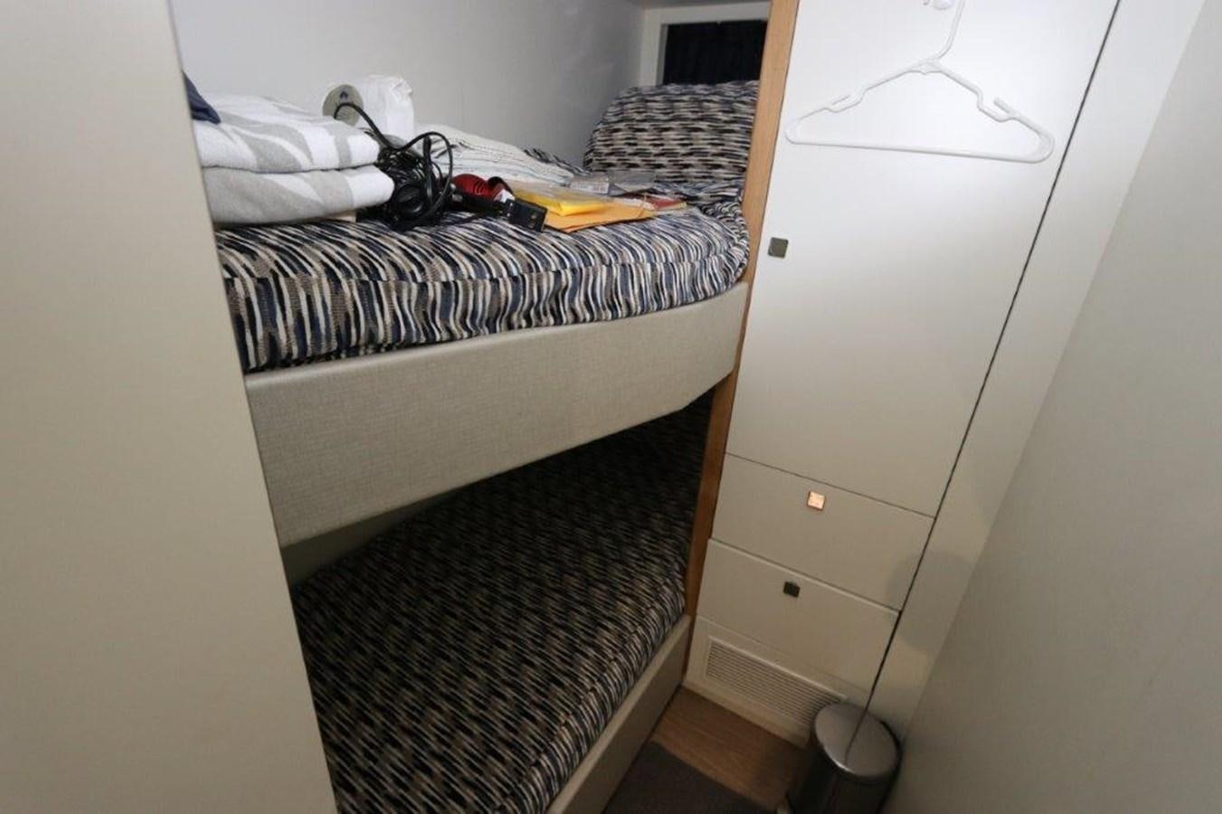 a closet with clothes on it aboard AQUA VISTA Yacht for Sale