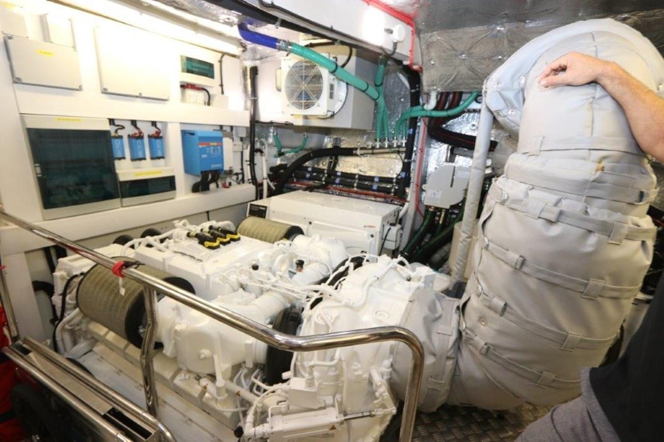 a person in a room with a white machine aboard AQUA VISTA Yacht for Sale
