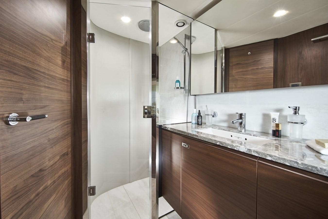 a bathroom with a large mirror aboard PRINCESS Y85/504 Yacht for Sale