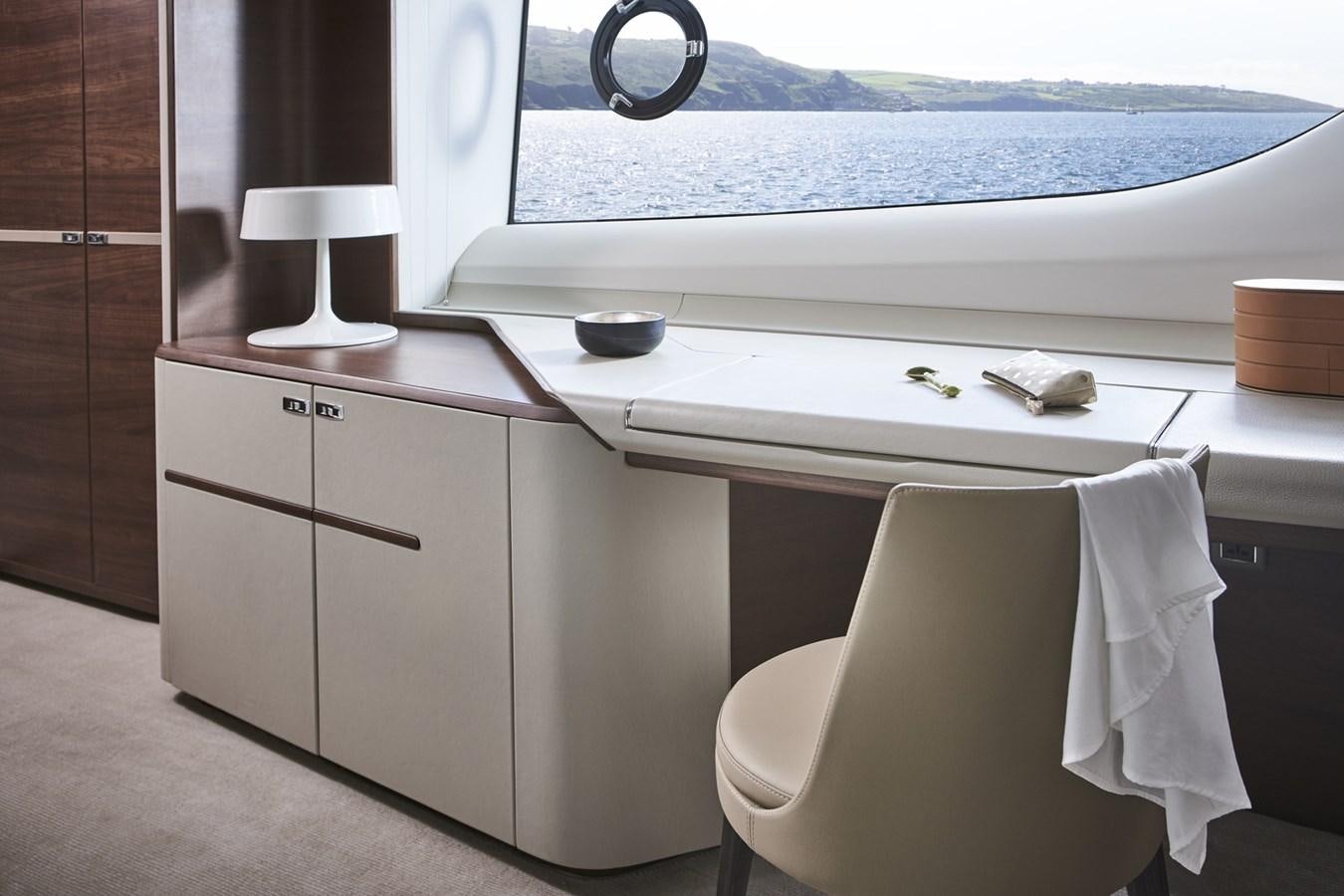a white kitchen with a white counter aboard PRINCESS Y85/504 Yacht for Sale