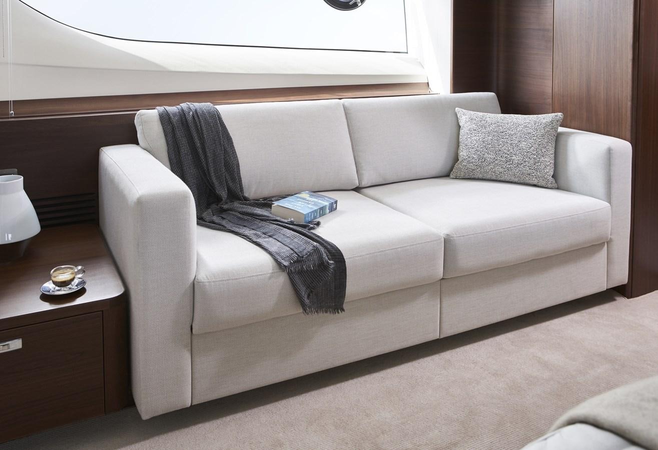 a couch with a pillow and a pillow on it aboard PRINCESS Y85/504 Yacht for Sale