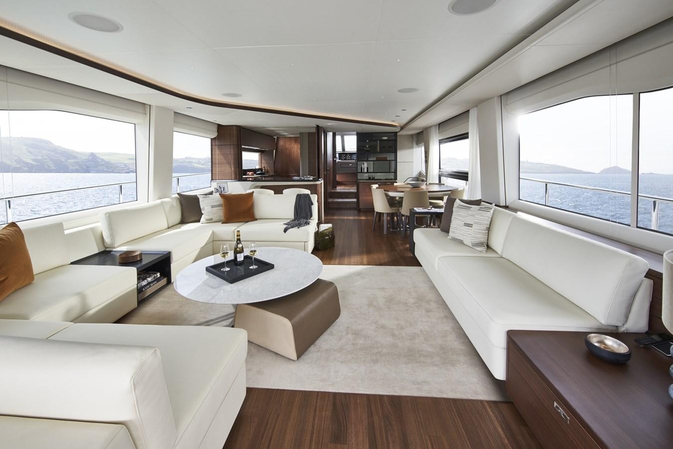 a living room with a large window aboard PRINCESS Y85/504 Yacht for Sale