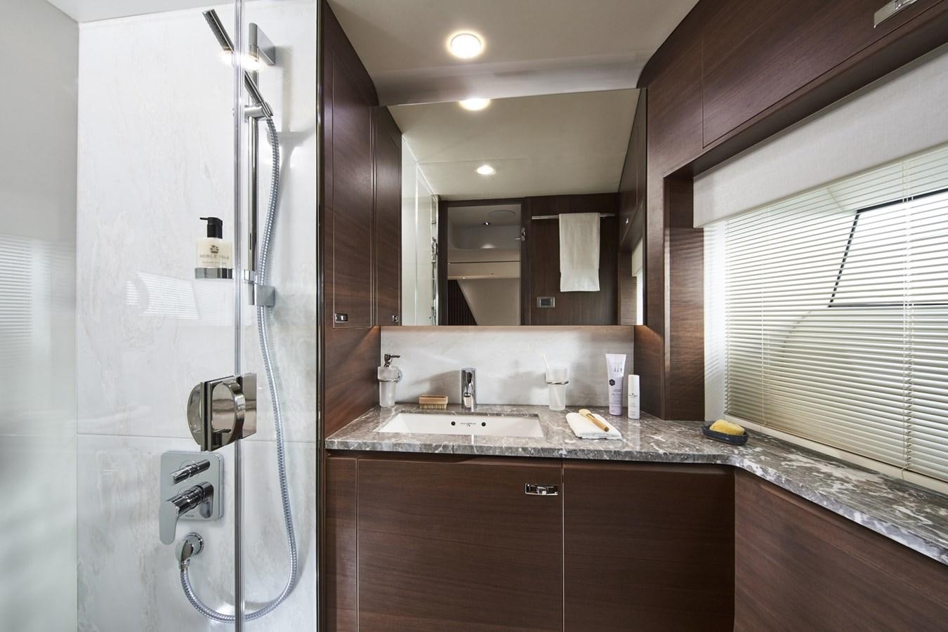 a bathroom with a shower unit and sink aboard PRINCESS Y85/504 Yacht for Sale