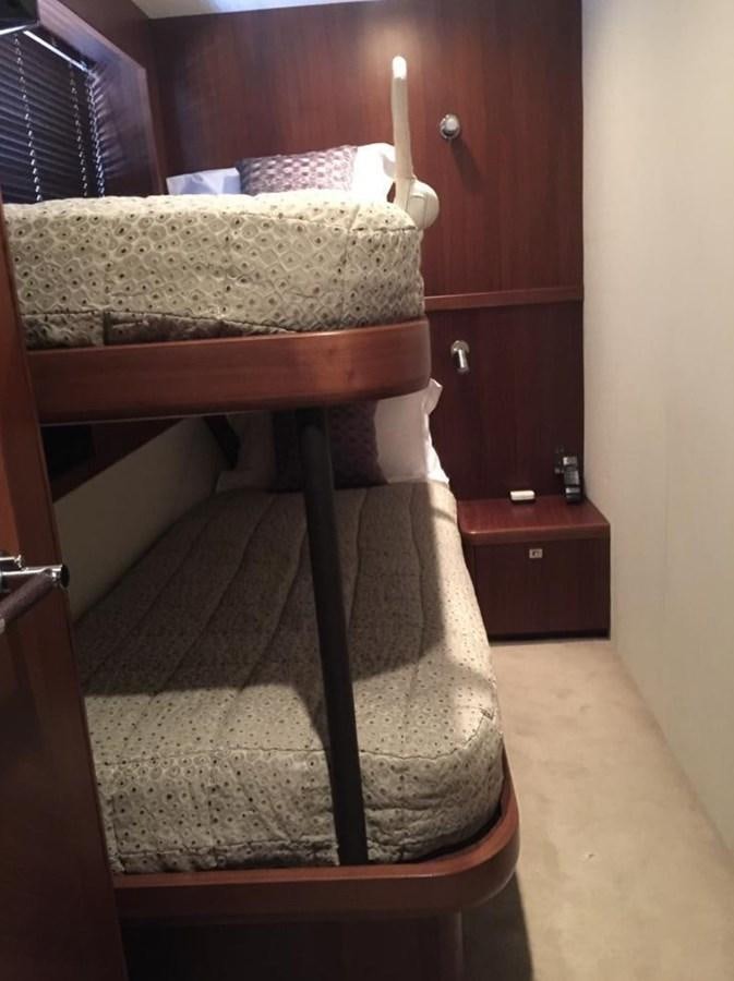 a bed with a chair aboard PRINCESS 85MY Yacht for Sale