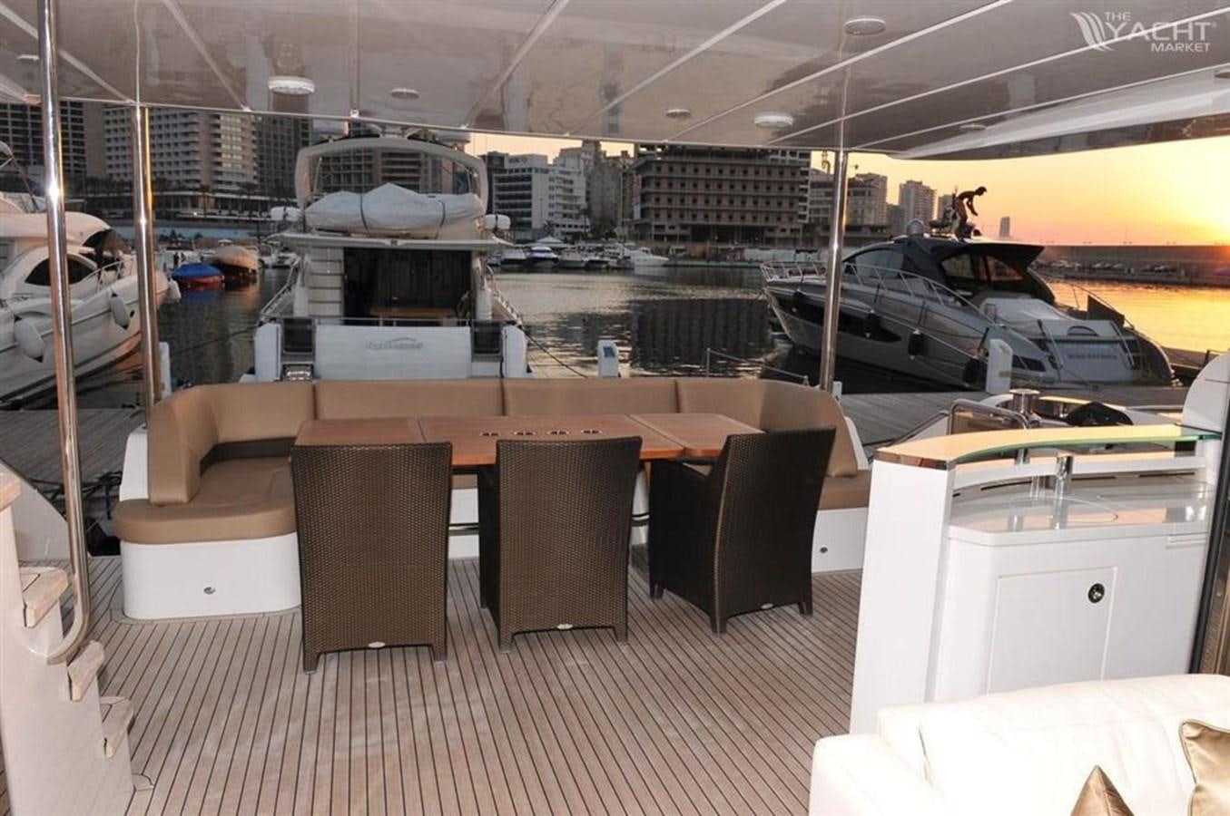 a room with a table chairs and a large window aboard PRINCESS 85MY Yacht for Sale