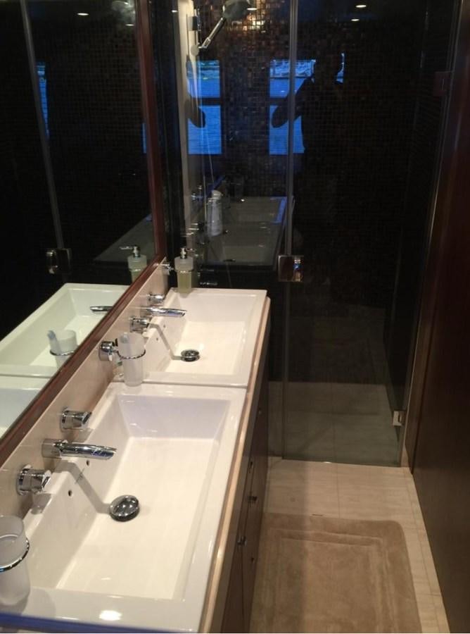 a bathroom with sinks and mirrors aboard PRINCESS 85MY Yacht for Sale
