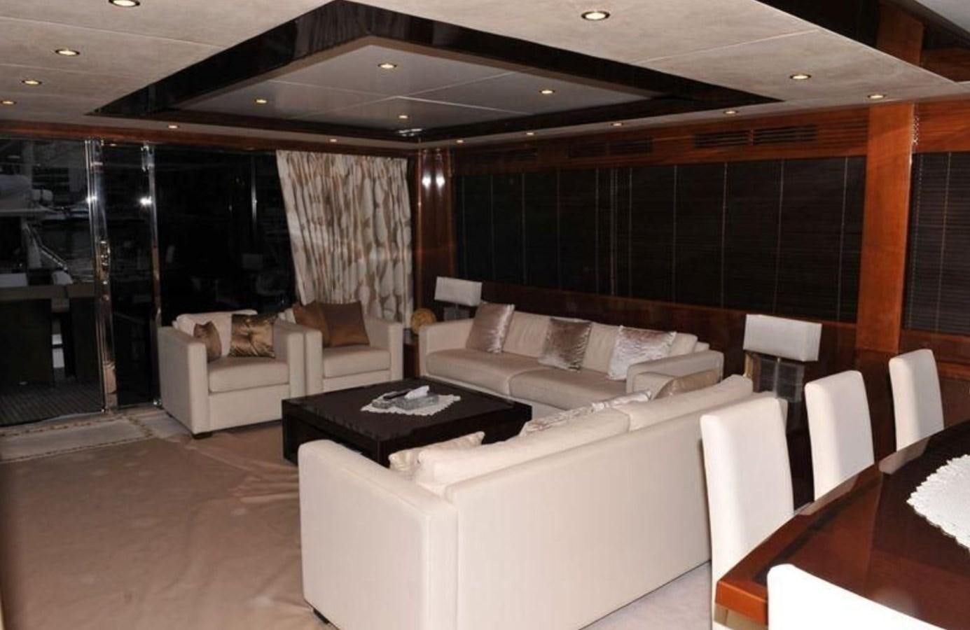 a room with a table and chairs aboard PRINCESS 85MY Yacht for Sale