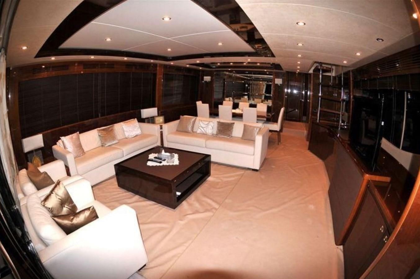 a room with a couch and a table aboard PRINCESS 85MY Yacht for Sale