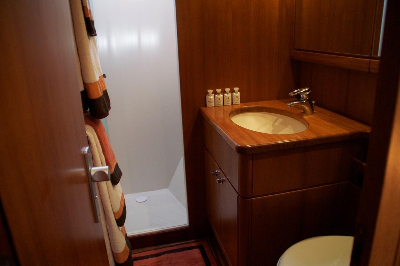 a bathroom with a sink and a toilet aboard VOLADOR Yacht for Sale