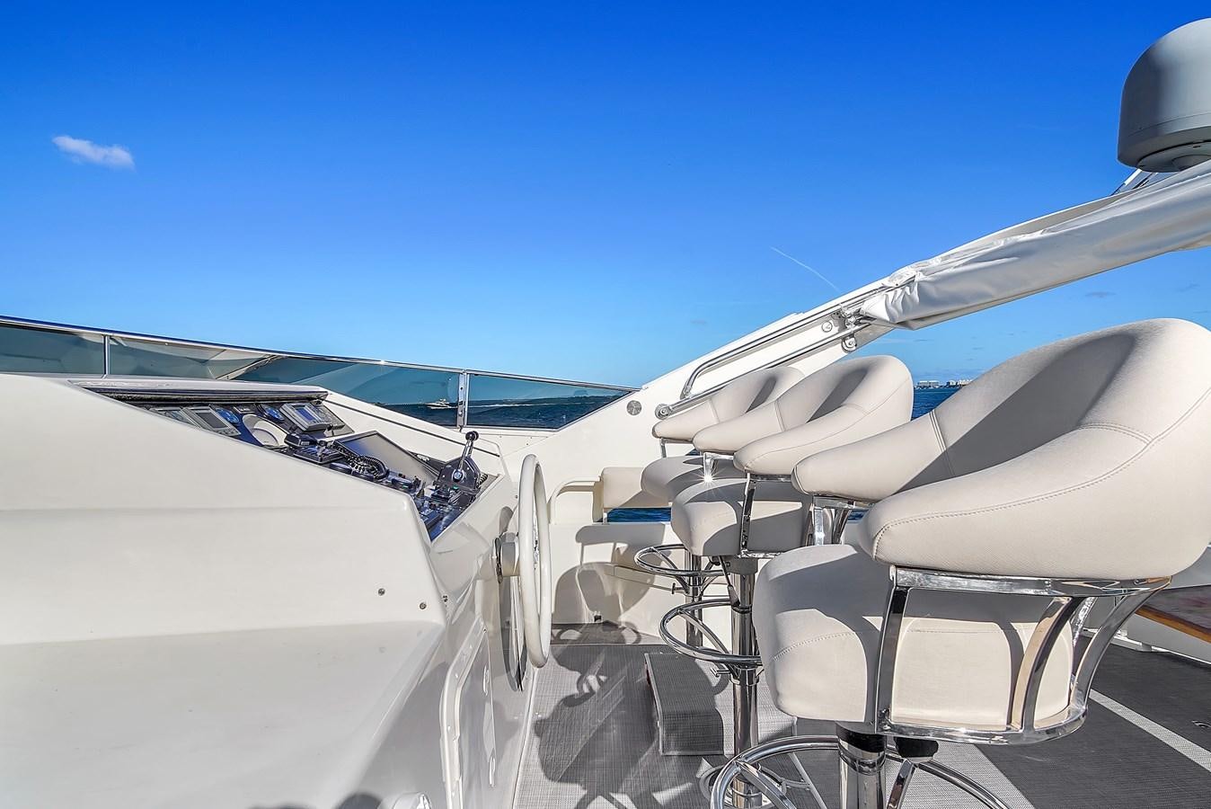 a plane with a chair and a table aboard ZOOOM Yacht for Sale