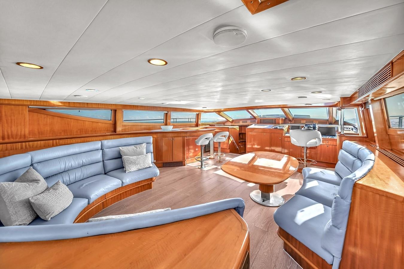 a living room with a large wood floor aboard ZOOOM Yacht for Sale