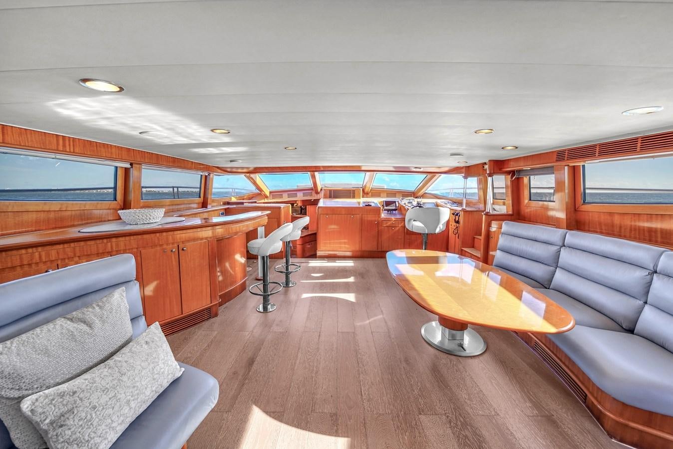 a room with a couch and a table and chairs aboard ZOOOM Yacht for Sale