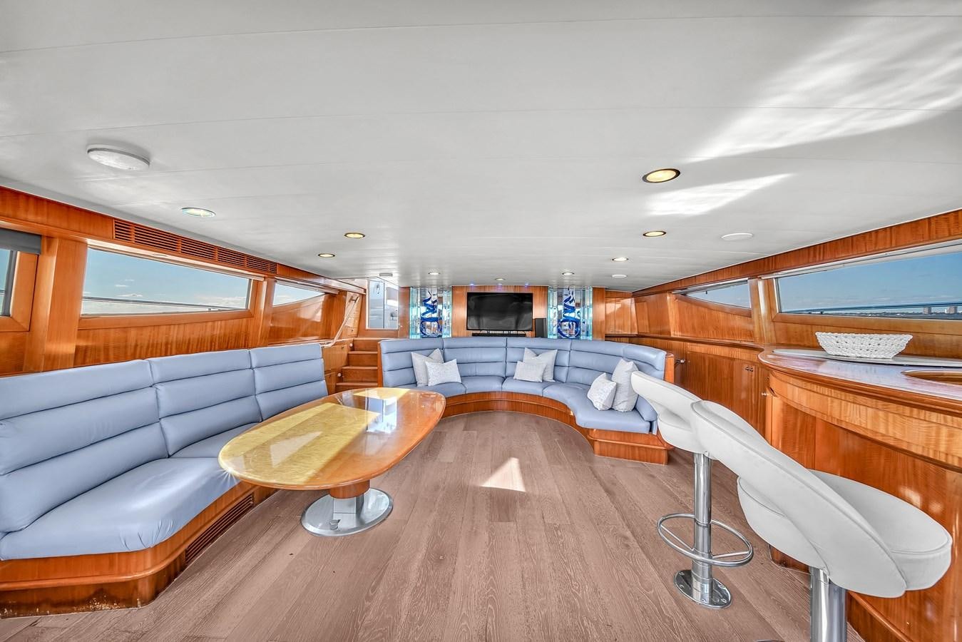 a room with a couch and a table aboard ZOOOM Yacht for Sale