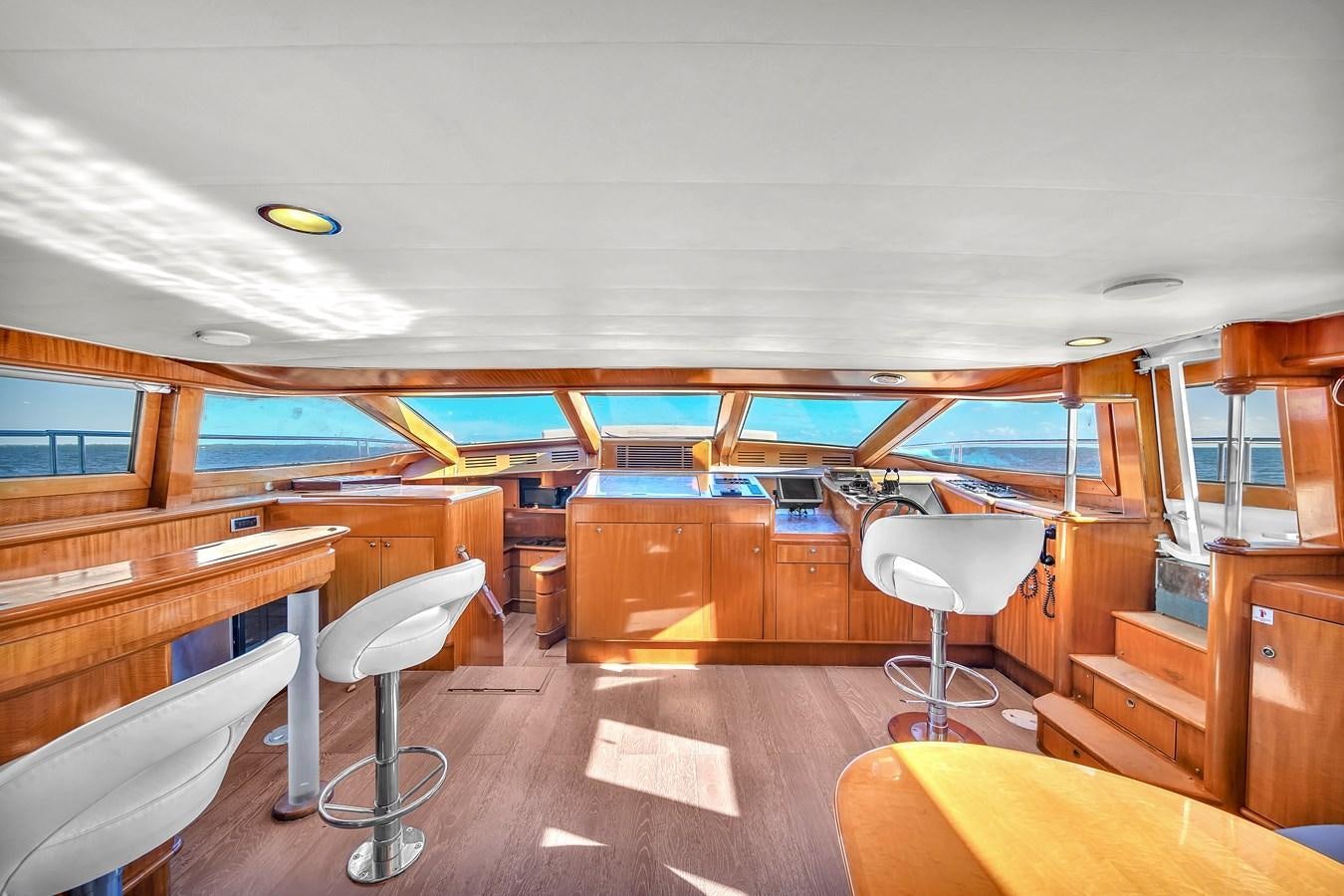 a room with a desk and chairs aboard ZOOOM Yacht for Sale
