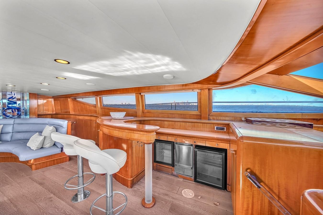 a room with a table and chairs aboard ZOOOM Yacht for Sale