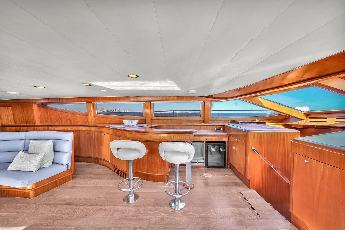 a room with a couch and a chair and a table aboard ZOOOM Yacht for Sale