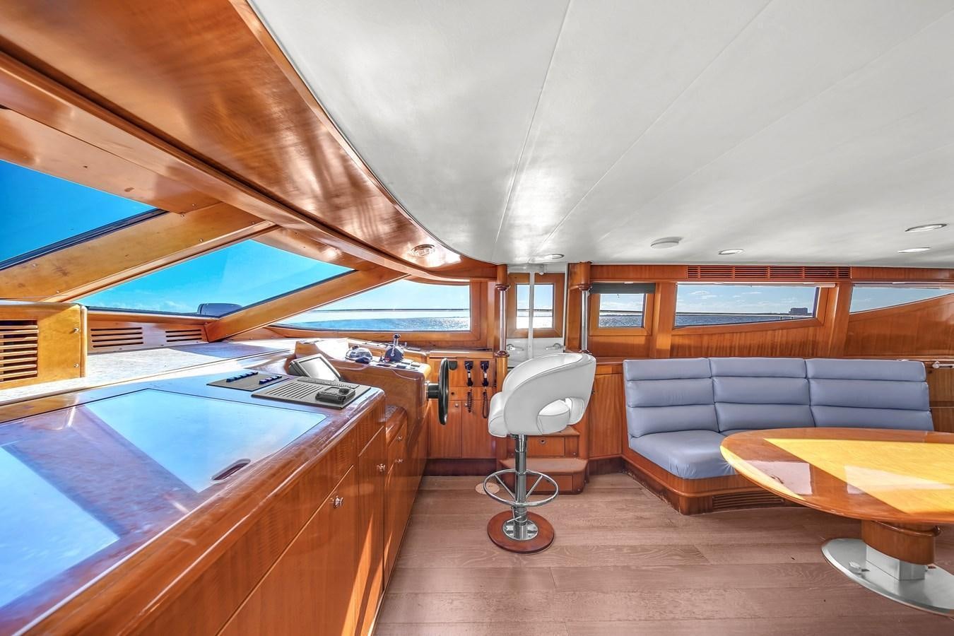 a room with a couch and a table aboard ZOOOM Yacht for Sale