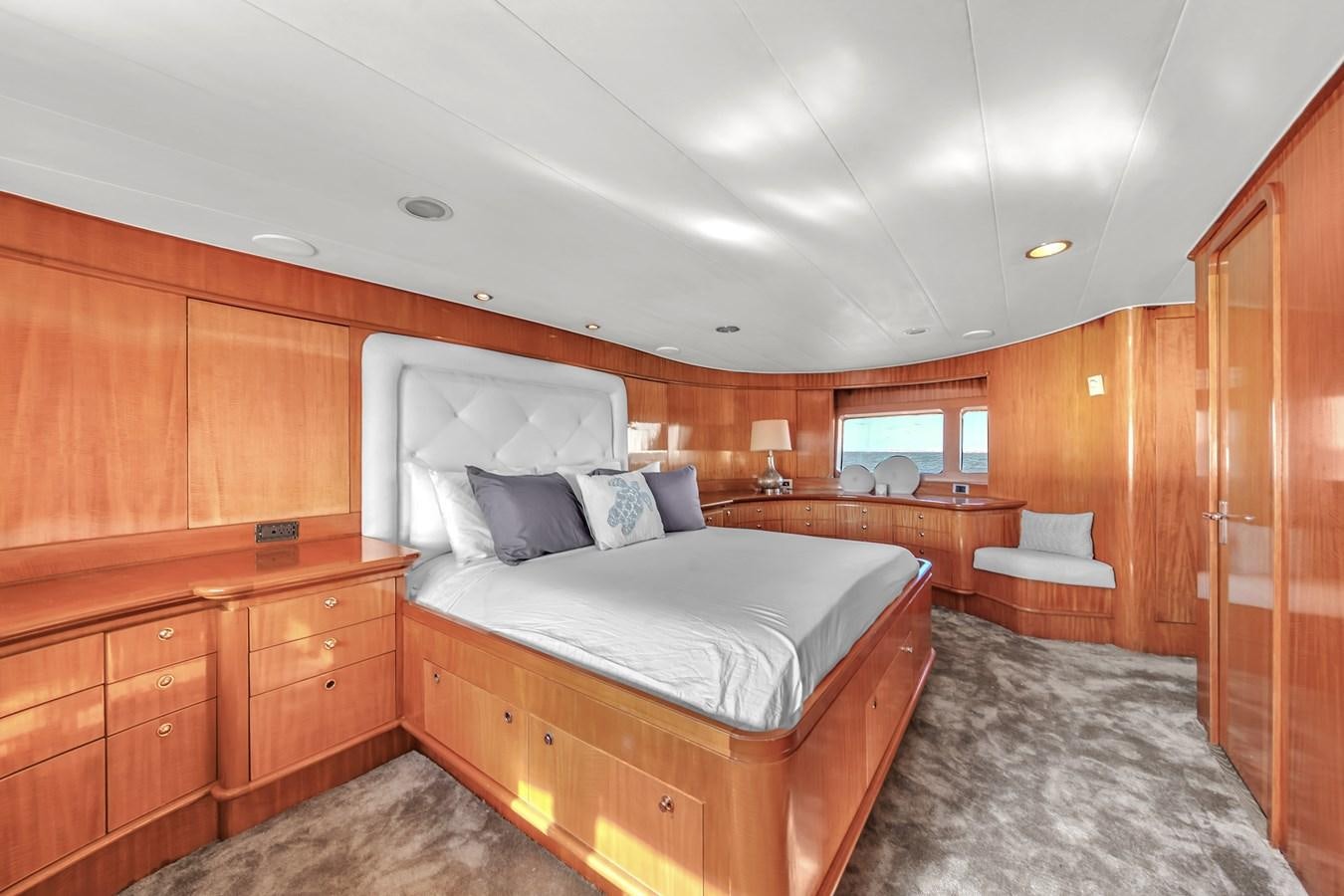 a room with a bed and a chair aboard ZOOOM Yacht for Sale