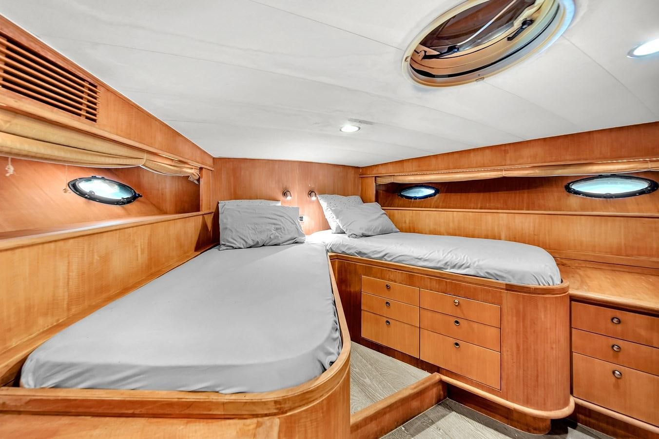 a couple of beds in a room aboard ZOOOM Yacht for Sale