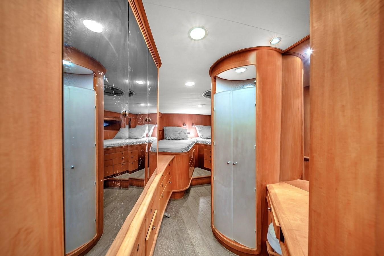 a room with wooden cabinets and a bed aboard ZOOOM Yacht for Sale