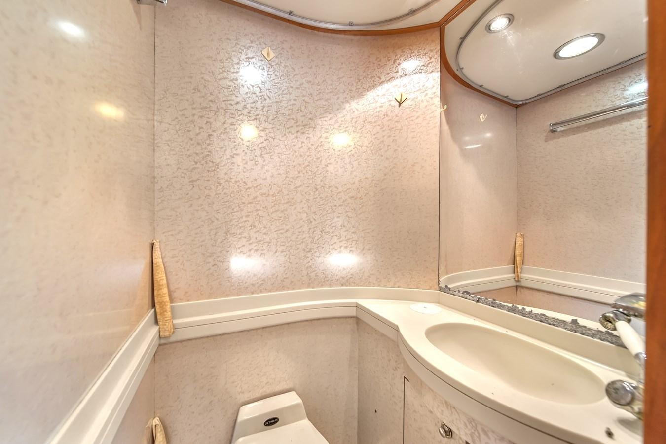 a bathroom with a large mirror aboard ZOOOM Yacht for Sale