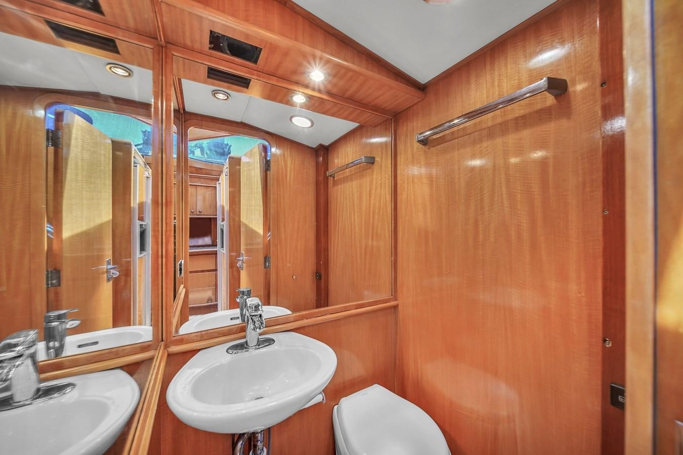 a bathroom with a sink and a toilet aboard ZOOOM Yacht for Sale