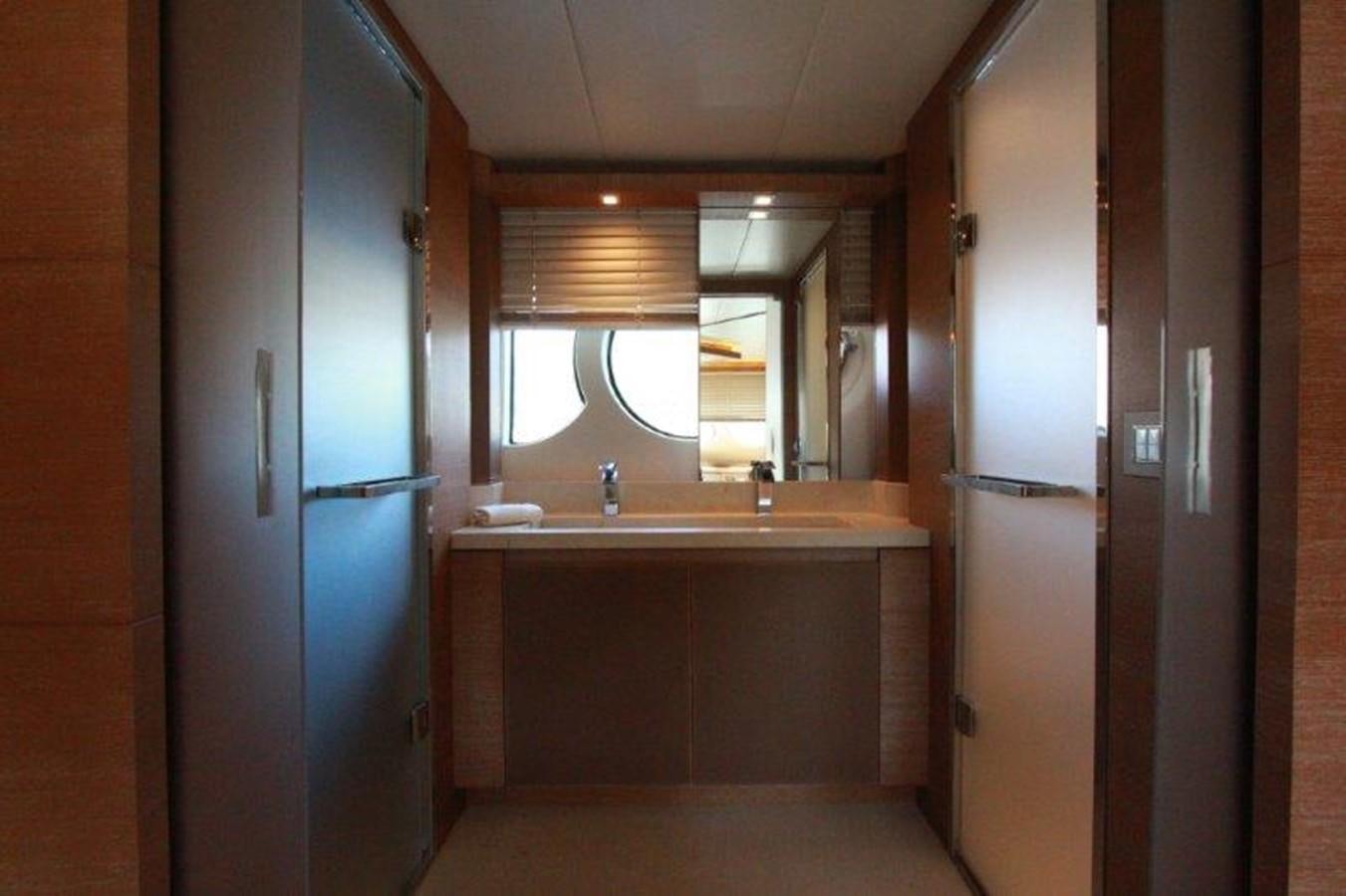 a bathroom with a sink and a mirror aboard AURORE Yacht for Sale
