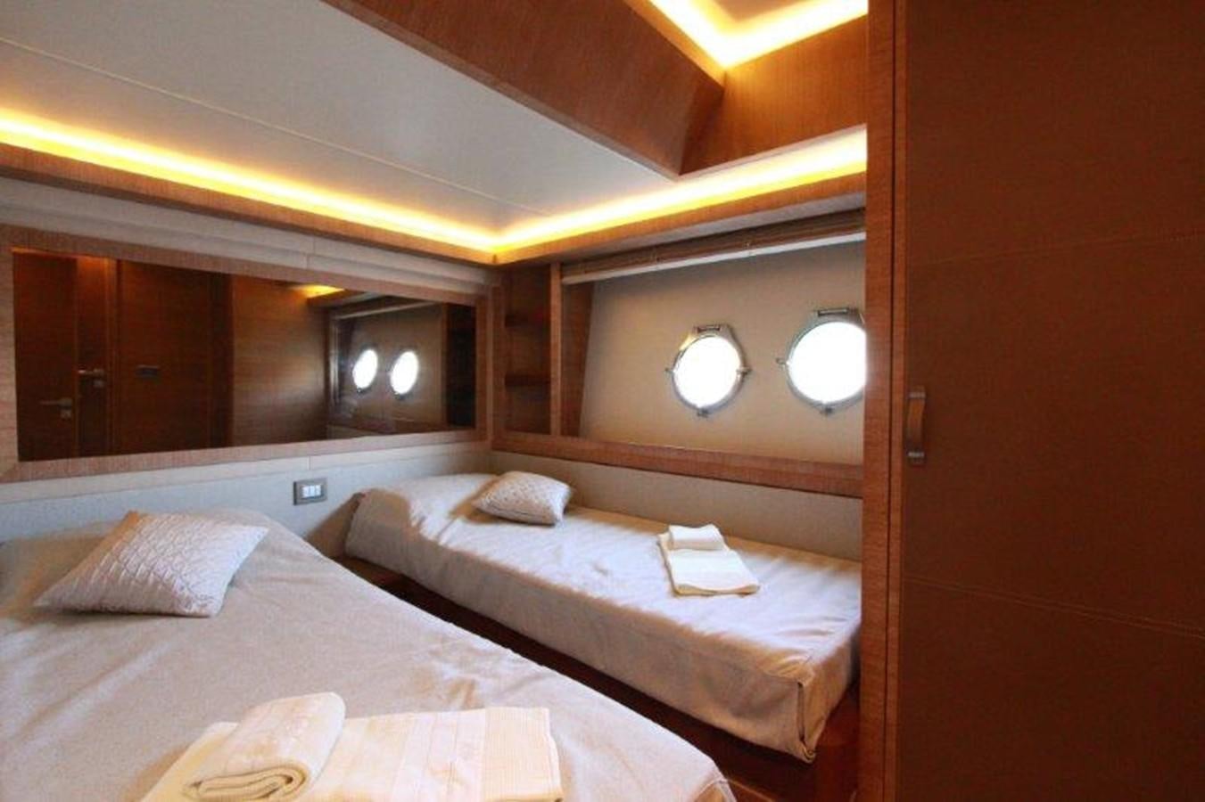 a room with two beds aboard AURORE Yacht for Sale