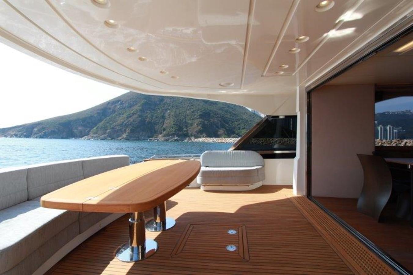 a room with a table and chairs aboard AURORE Yacht for Sale