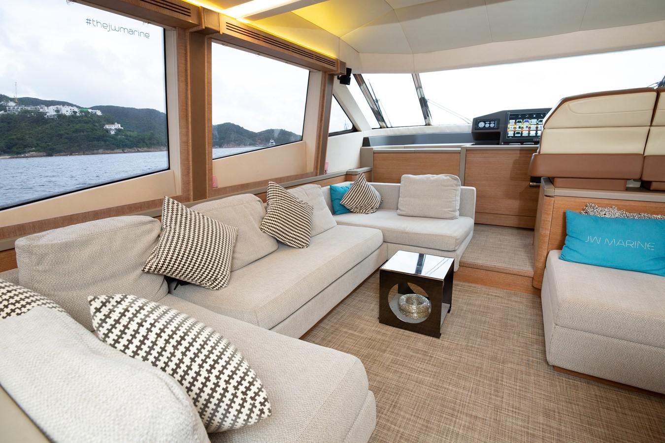 a room with a couch and a window aboard AURORE Yacht for Sale