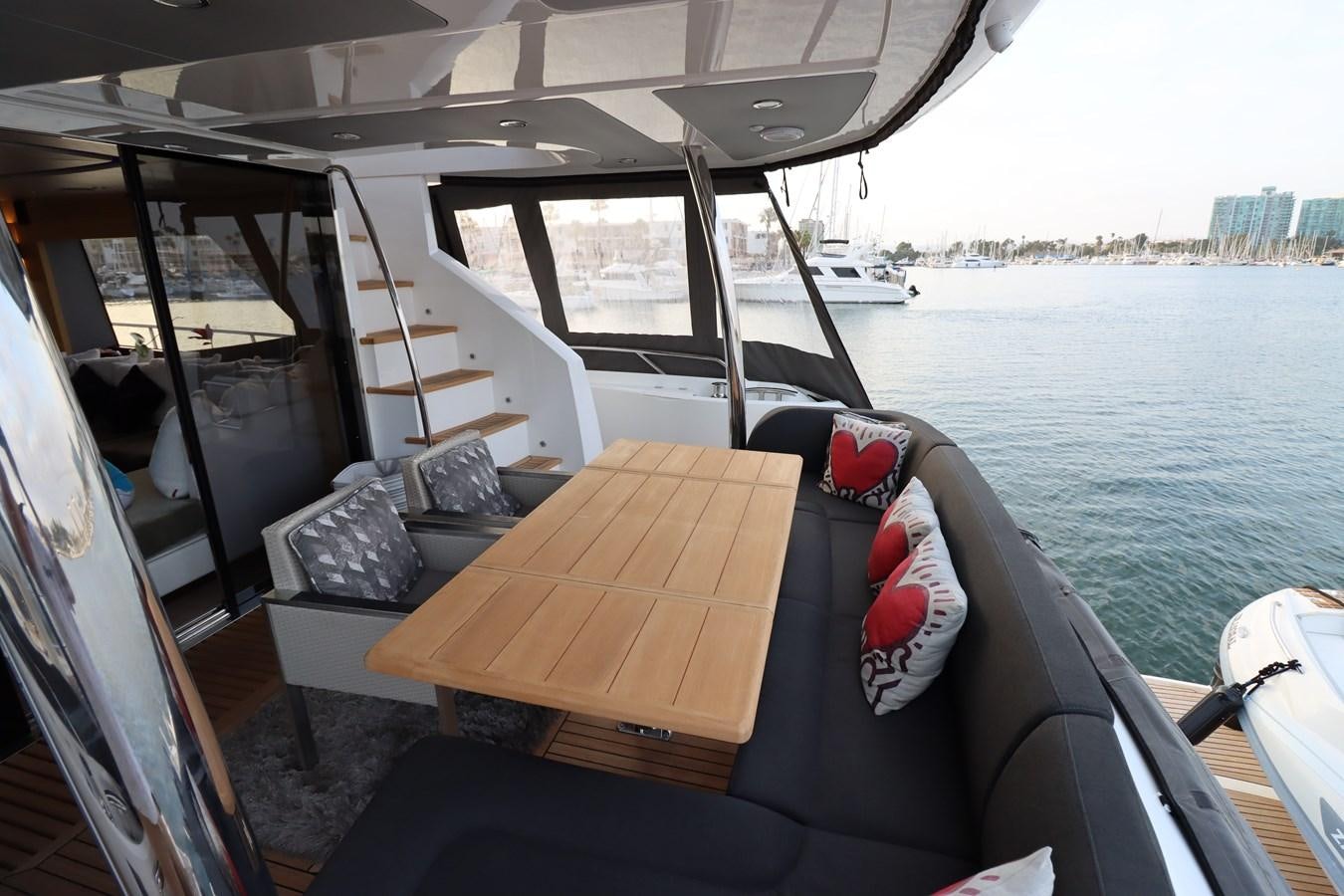 a boat with a table on it aboard MOJO RISIN Yacht for Sale