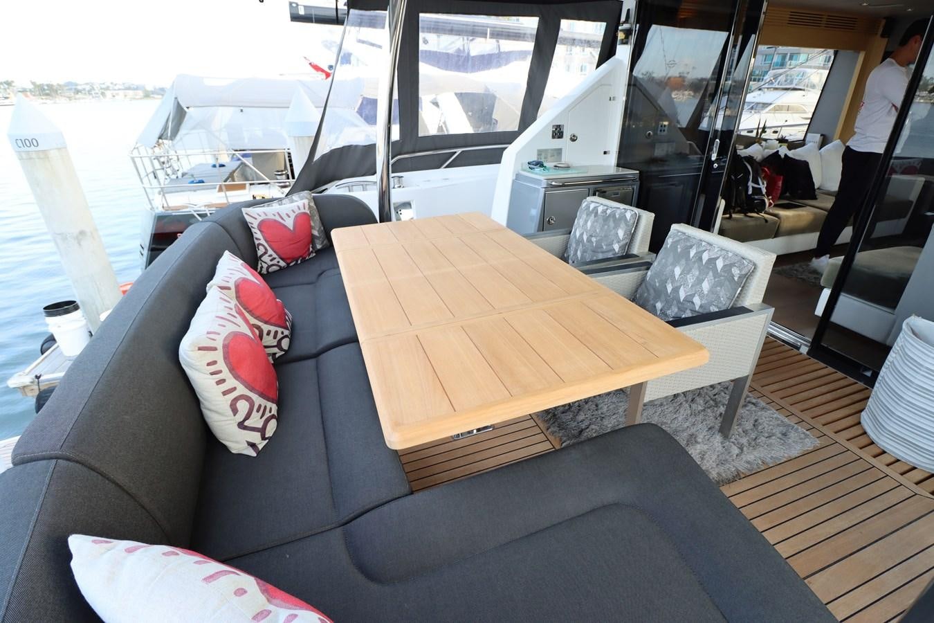 a boat with a table and chairs aboard MOJO RISIN Yacht for Sale