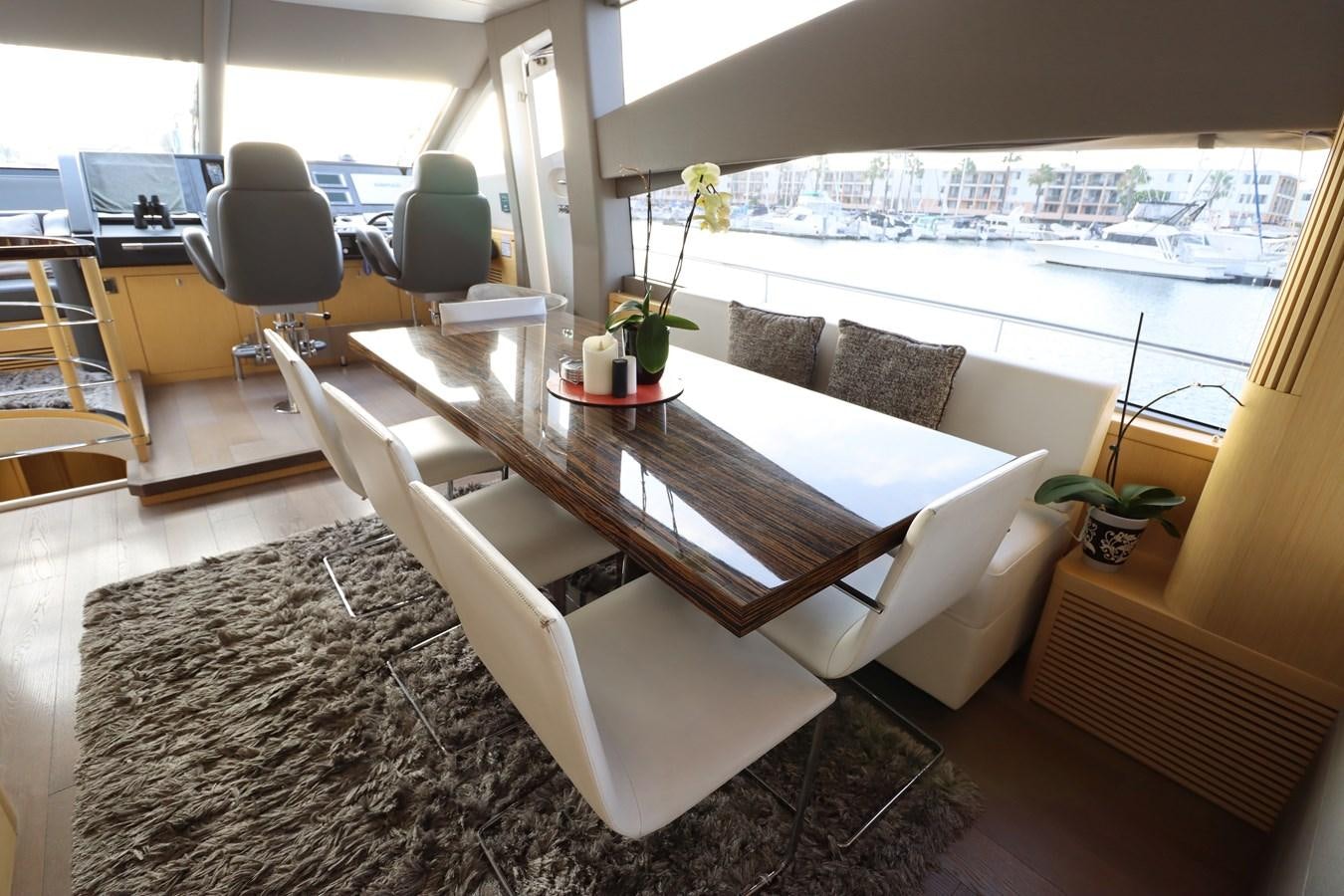 a room with a couch and a table aboard MOJO RISIN Yacht for Sale