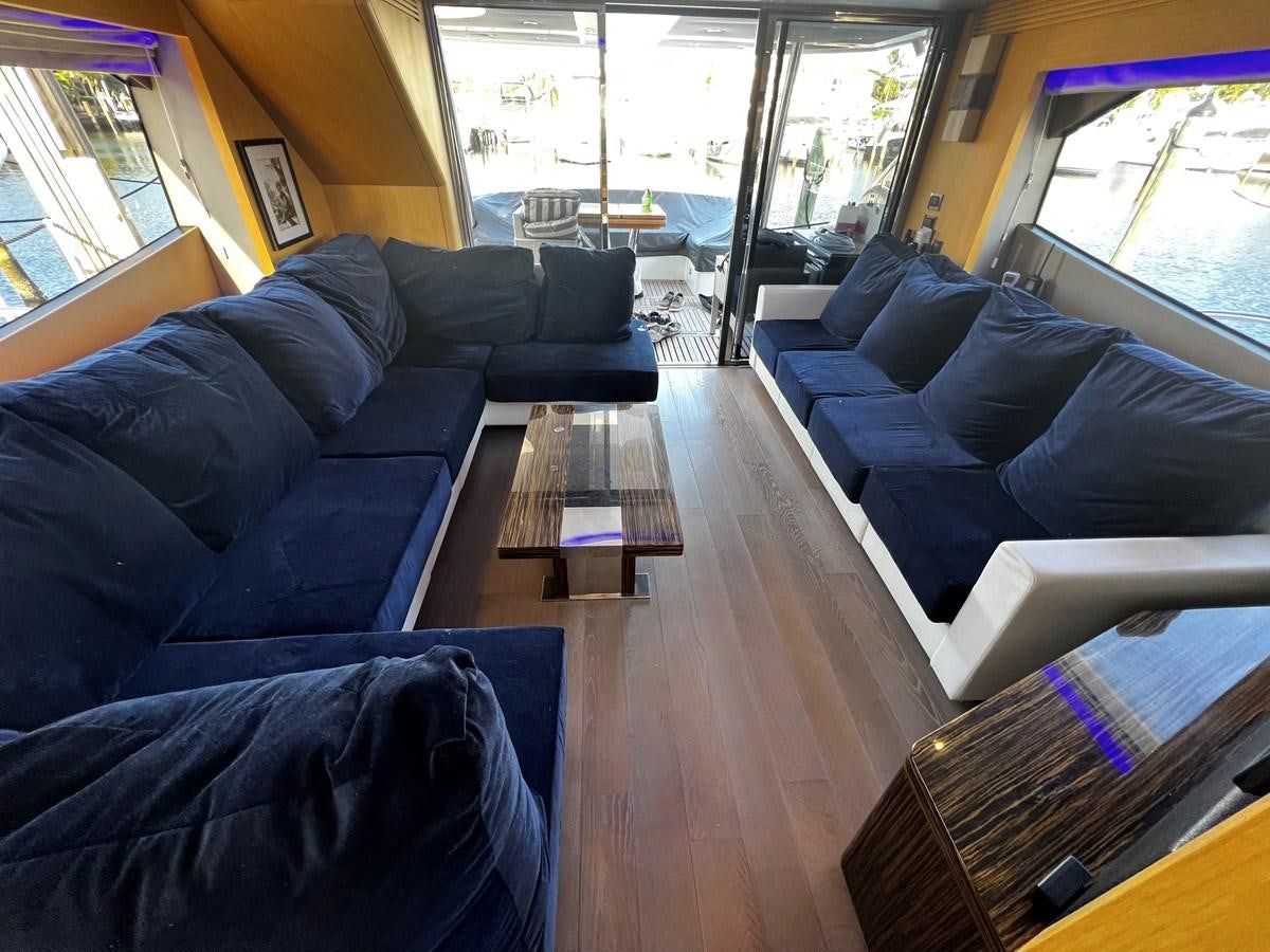 a living room with a wood floor aboard MOJO RISIN Yacht for Sale