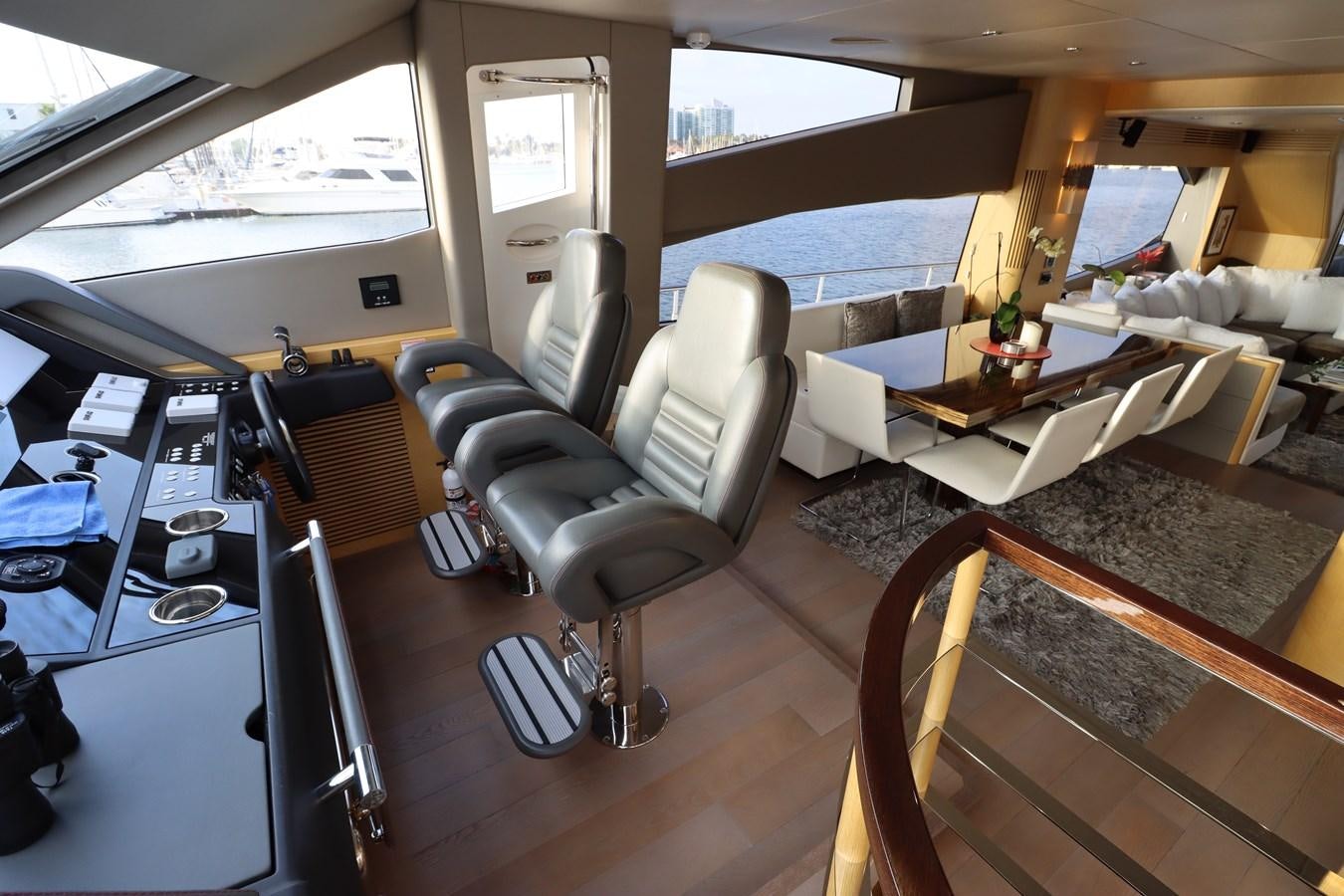 a cockpit with a desk and chairs aboard MOJO RISIN Yacht for Sale