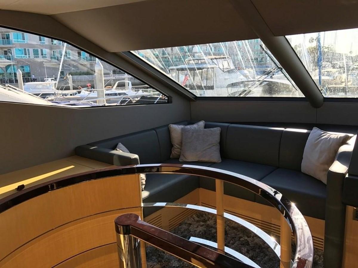 a couch with a pillow on it aboard MOJO RISIN Yacht for Sale