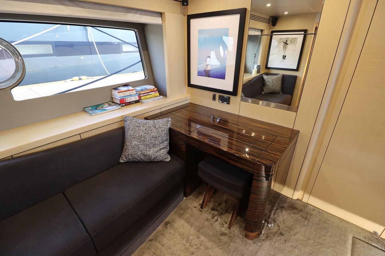 a living room with a piano aboard MOJO RISIN Yacht for Sale