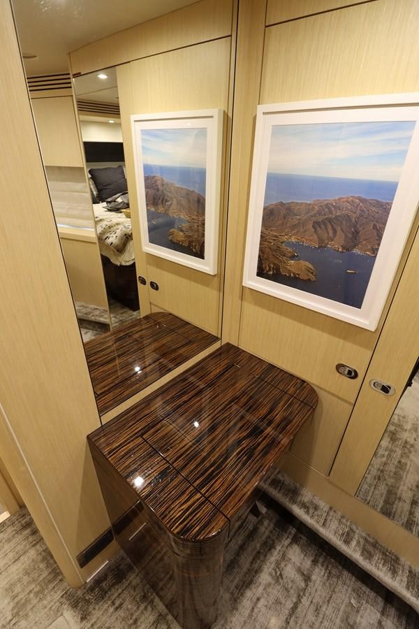 a room with a painting on the wall aboard MOJO RISIN Yacht for Sale