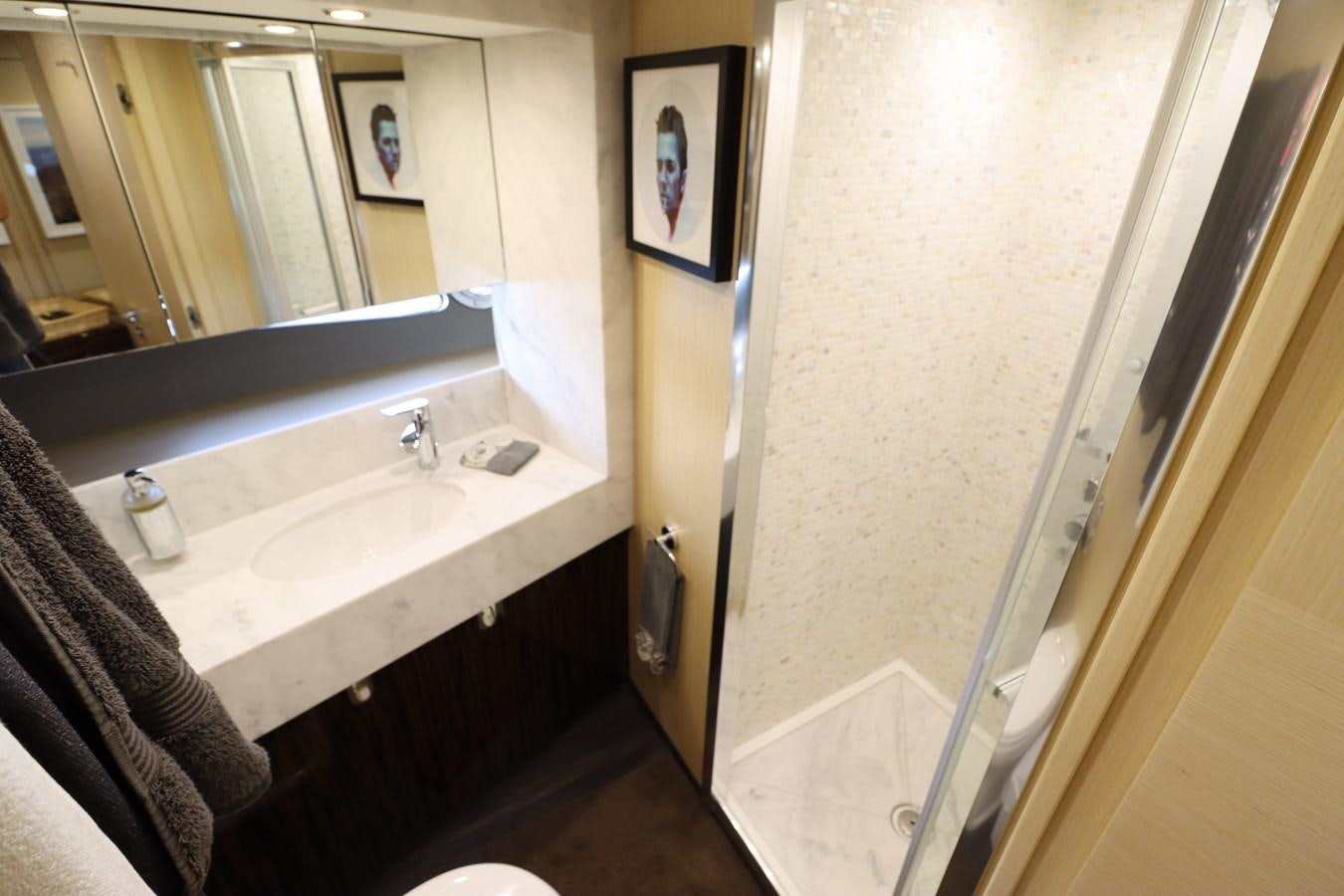 a bathroom with a sink and mirror aboard MOJO RISIN Yacht for Sale