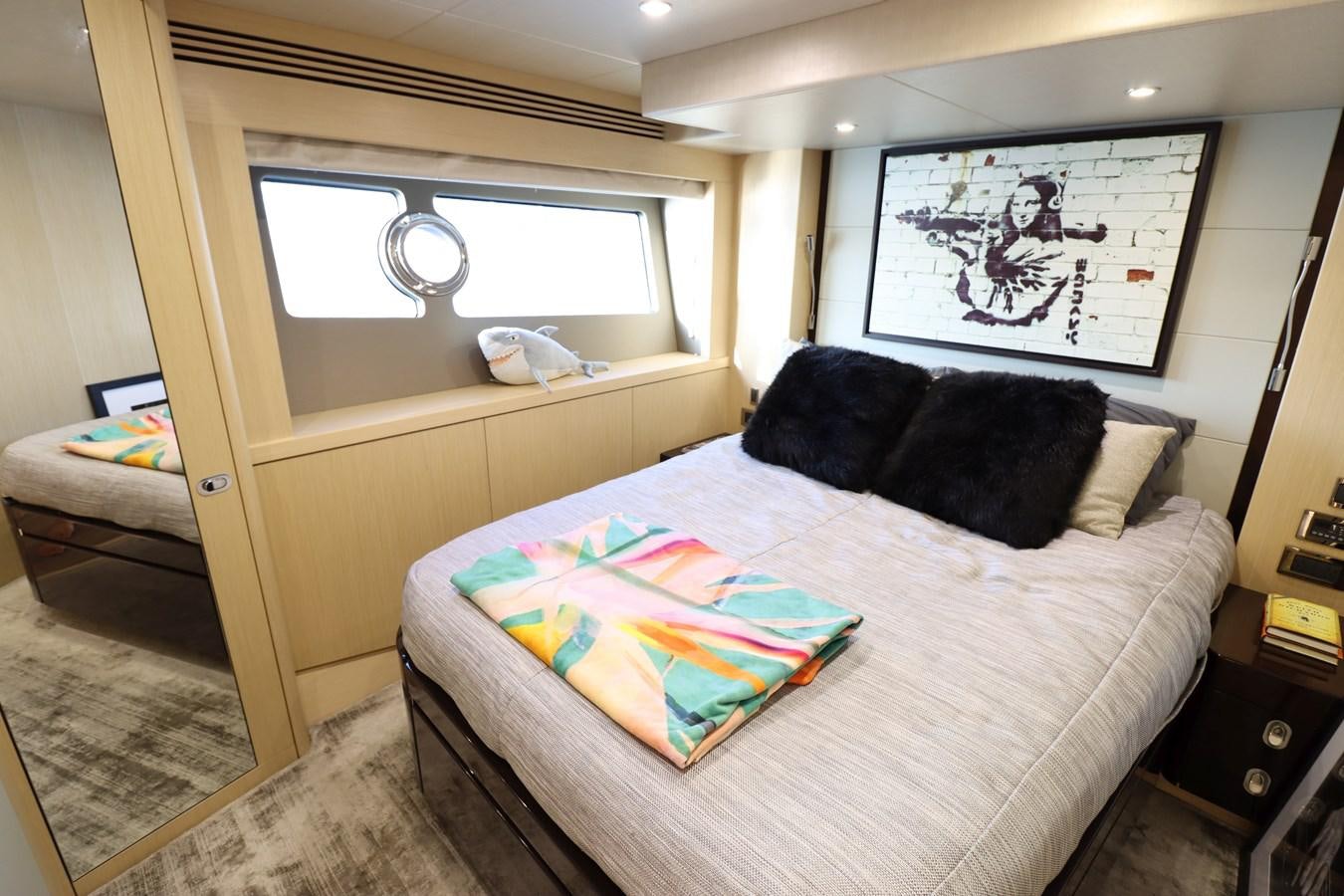 a bed in a room aboard MOJO RISIN Yacht for Sale