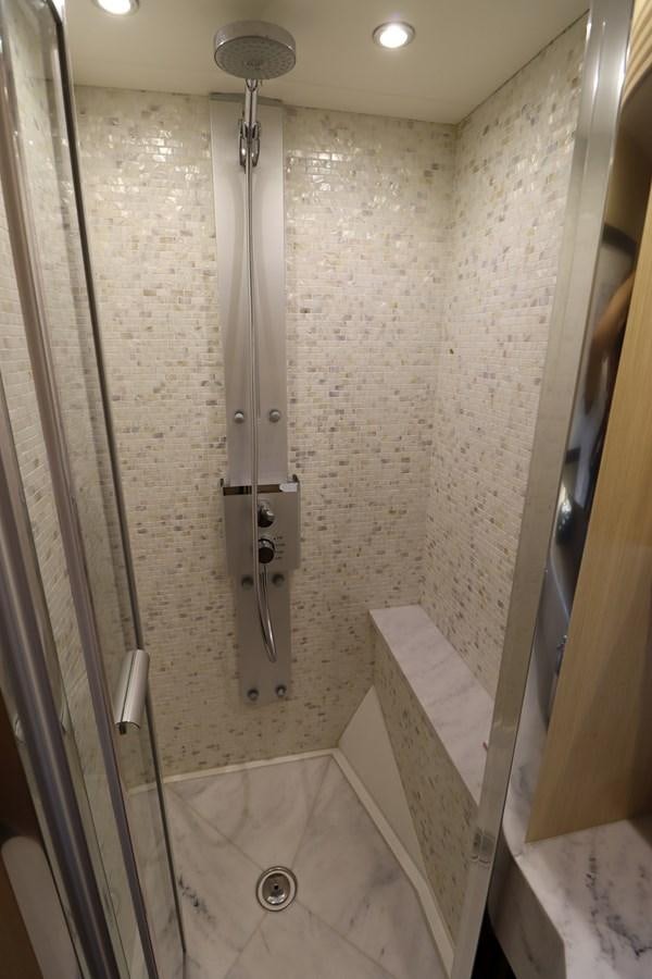 a shower with a glass door aboard MOJO RISIN Yacht for Sale