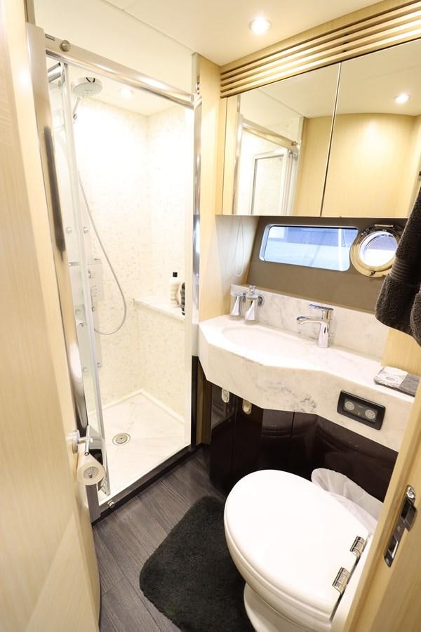 a bathroom with a sink and a toilet aboard MOJO RISIN Yacht for Sale