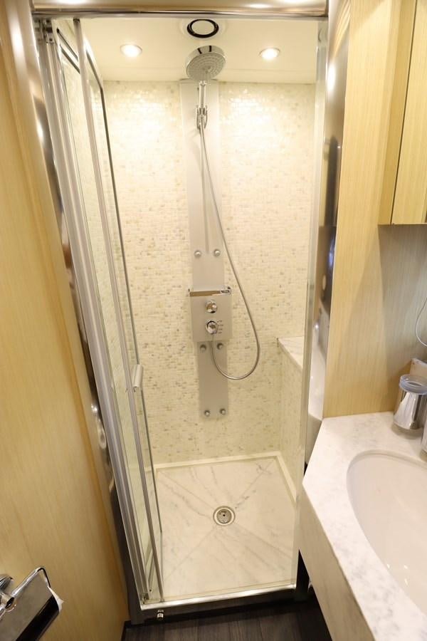 a shower with a shower head aboard MOJO RISIN Yacht for Sale