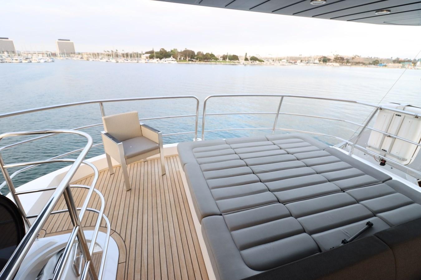 a deck with chairs on it aboard MOJO RISIN Yacht for Sale