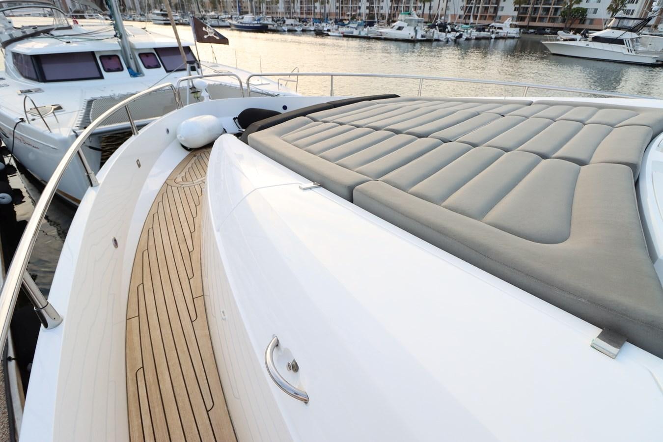 a boat with a wooden deck aboard MOJO RISIN Yacht for Sale