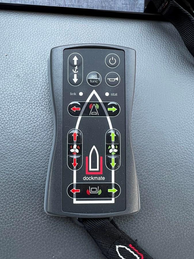 a remote control on a car seat aboard MOJO RISIN Yacht for Sale