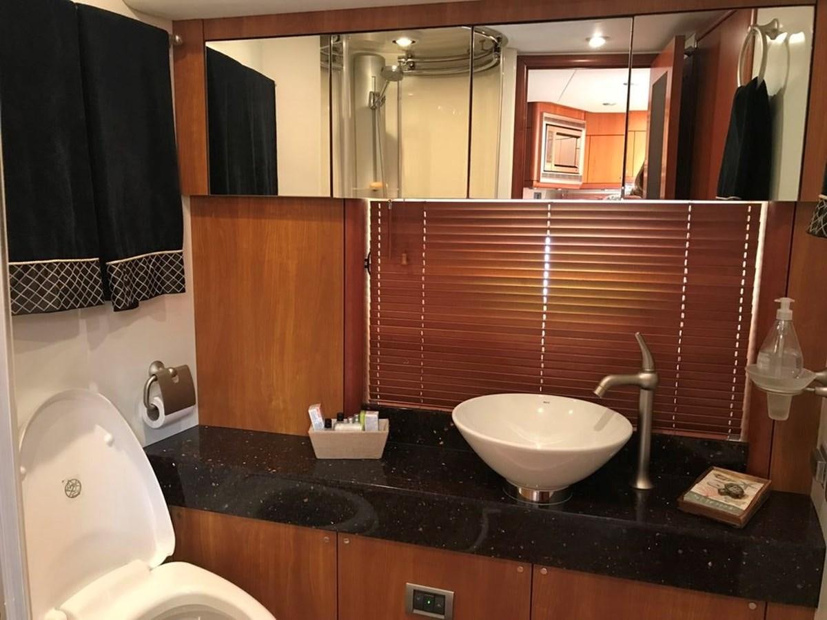 a bathroom with a sink and a toilet aboard DAY DREAMER Yacht for Sale