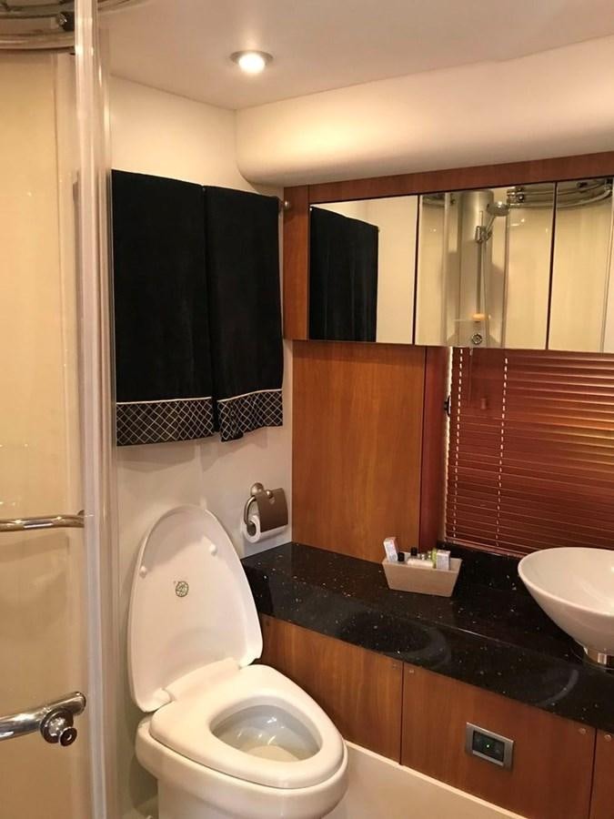 a bathroom with a toilet and sink aboard DAY DREAMER Yacht for Sale