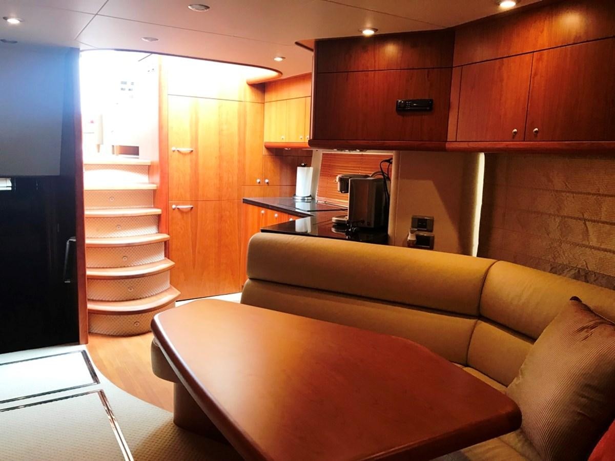 a kitchen with a staircase aboard DAY DREAMER Yacht for Sale