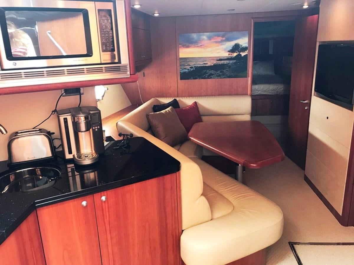 a living room with a couch and a coffee table aboard DAY DREAMER Yacht for Sale